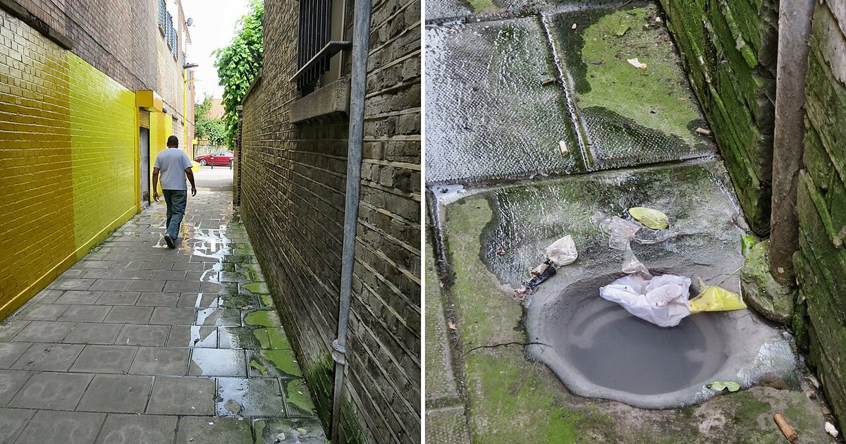 Blocked outdoor drain gully beside a footpath