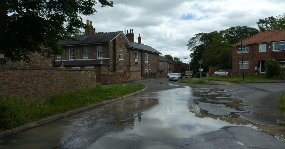 A residential street under water after a burst water main