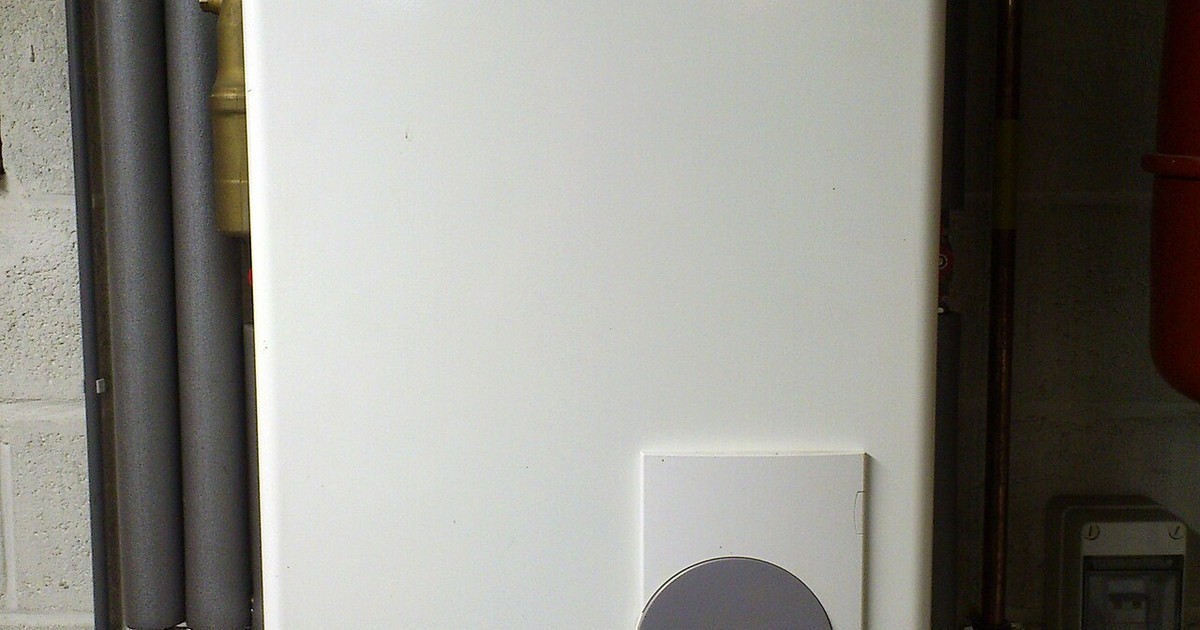 A gas continuous-flow hot water unit mounted on an outside wall