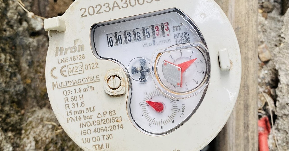 A water meter with its dial and register