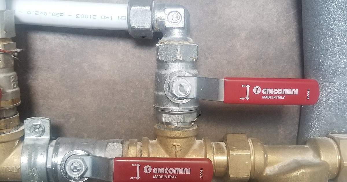A brass ball valve fitted to copper pipework
