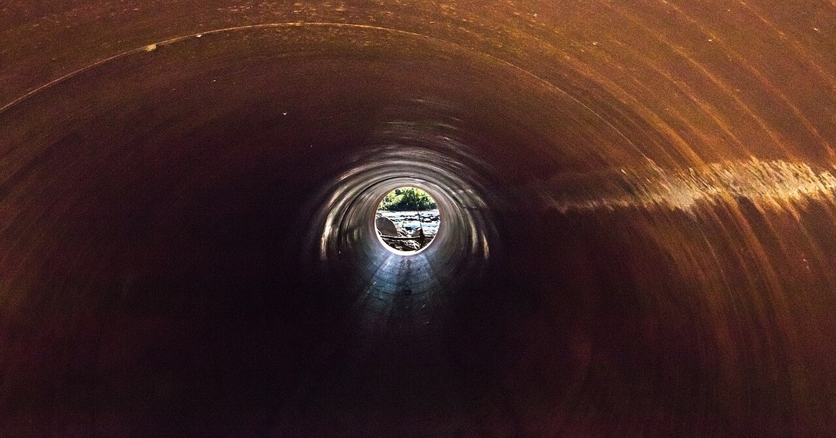 Looking down the inside of a pipe that has rusted through