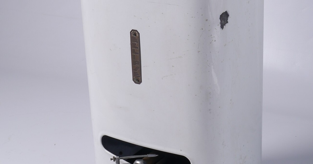 A white continuous-flow hot water unit mounted on a wall